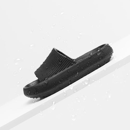 a black slipper on a white shelf